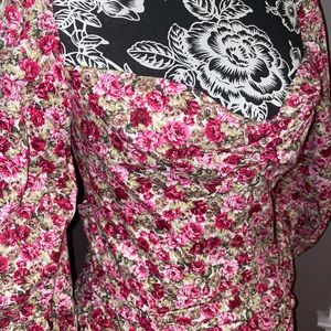 Floral open back puff sleeved midi dress.